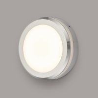Polished Aluminium Round Wall Light in Situ on a Grey Wall