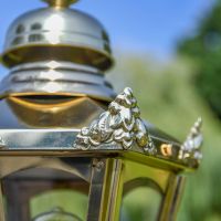 Ornate Brass Ears on the Corners of the Lantern