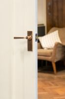 Polished Copper Lever Latch Door Handle in Situ