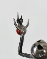 Close up of The Pumpkin King Sculpture top hand with bauble
