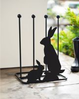 Black steel boot rack with mother and baby rabbit silhouettes