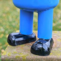Close-Up of Legs on Fireman Henchman Sculpture