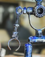 Close up of intricate detail on recycled metal art sculpture