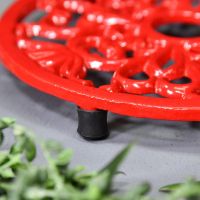 Close-up of the Feet on the Red Heavy Duty Cast Iron Round Trivet