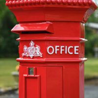 Close-Up on White Detailing on Penfold Pillar Post Box - Red Finish