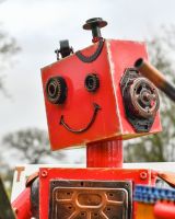 Close up of robot face detail on recycled metal art sculpture