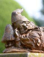 Close-up of Cast Iron Relaxing Gnome Sculpture