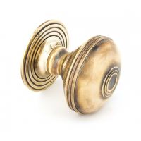 Ribbed Antique Brass Centre Door Knob Set