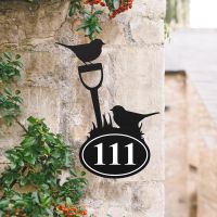 Robin Iron House Number Sign in Situ on a Rustic Wall 