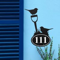 Robin Iron House Number Sign in Situ on a Blue Wall 