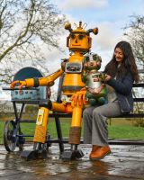 Scale image of robot with moveable baby garden bench