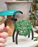 scale of scrap metal art sculpture