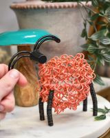 Scale of recycled art sculpture