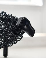 Close up of face detail on recycled metal art sculpture