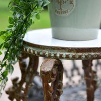 Close up of Rustic Cast Iron Side Table
