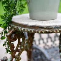 Close up of Rustic Cast Iron Victorian Table