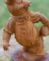 Close-Up of Rustic Cast Iron "American Football Player" Pig Garden Sculpture