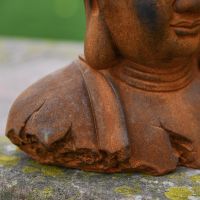 Close-up of the Rustic Finish on the Cast Iron Buddha Sculpture