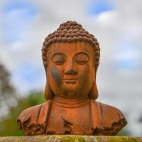 Rustic Cast Iron Buddha Sculpture in the Garden 