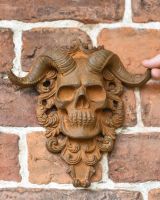 Scale Shot of Rustic Cast Iron "El Diablo" Exterior Wall Art