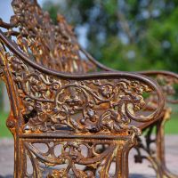 Close-up of the Detail on the Arms of the Bench