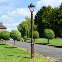 Rustic Copper Ornate Lamp Post Installed On Driveway