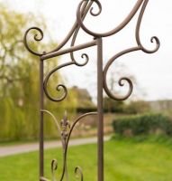 Close-up of the Scrolled Detailing on the Rustic Fleur De Lys Rose Arch