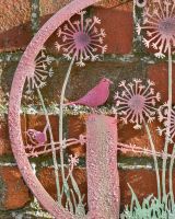 Birds perched amongst the dandellions