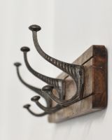 Close up of hooks on Rustic Wood And Iron Coat Hooks