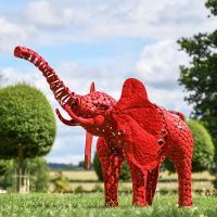 "Sambaku" Red Garden Elephant Sculpture in Use in the Garden