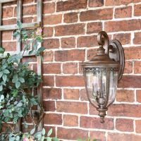 "Sandyway" Top Fix Bronze Wall Lantern on the Front of a House