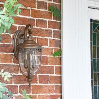 "Sandyway" Top Fix Bronze Wall Lantern in Situ Next to a Front Door
