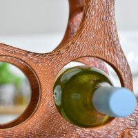 Close up of circular wine bottle holder within Rustic "Laying Stag" 