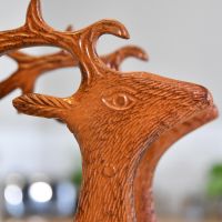 Close up of head of rustic "Laying Stag" with detailing 