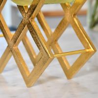 Close up of gold geometric grid wine rack 