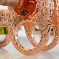 Close up of circular bottle holder within Copper "Angel Wings" Wine Rack 