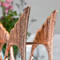 Close up of wing detailing on "Angel Wings" Wine Rack with Copper Finish 