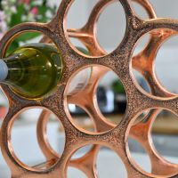 Close up of circular bottle holders in kitchen setting 