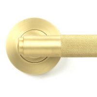 Close-Up of Satin Brass "Royale" Unsprung Door Handle on Rose Set