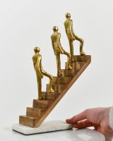 Scale image of interior ornament made from cast aluminium, mango wood and marble