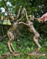 Scale image of fighting hares patio statue