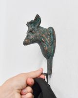 Scale image of verdigris coat hook