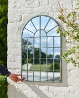 Scale image of arched garden mirror with metal frame