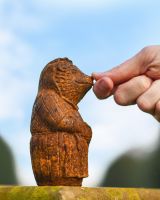 Scale image of rustic cast iron outdoor sculpture