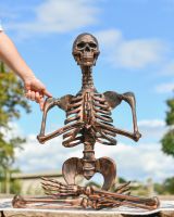 Scale image of copper skeleton outdoor sculpture