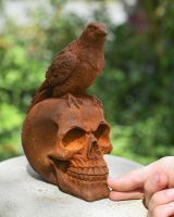 scale image of rustic finish cast iron skull ornament