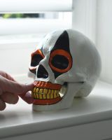 Scale of Orange Clown Skull Ornament 