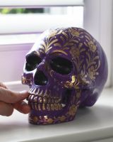 Scale image of floral purple skull