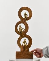 Scale image of cast aluminium and mango wood home decor sculpture