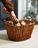Scale Shot of Aged Wicker Log Basket with Metal Handles 